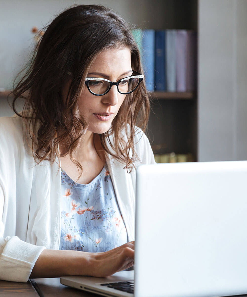 Person working on laptop at desk