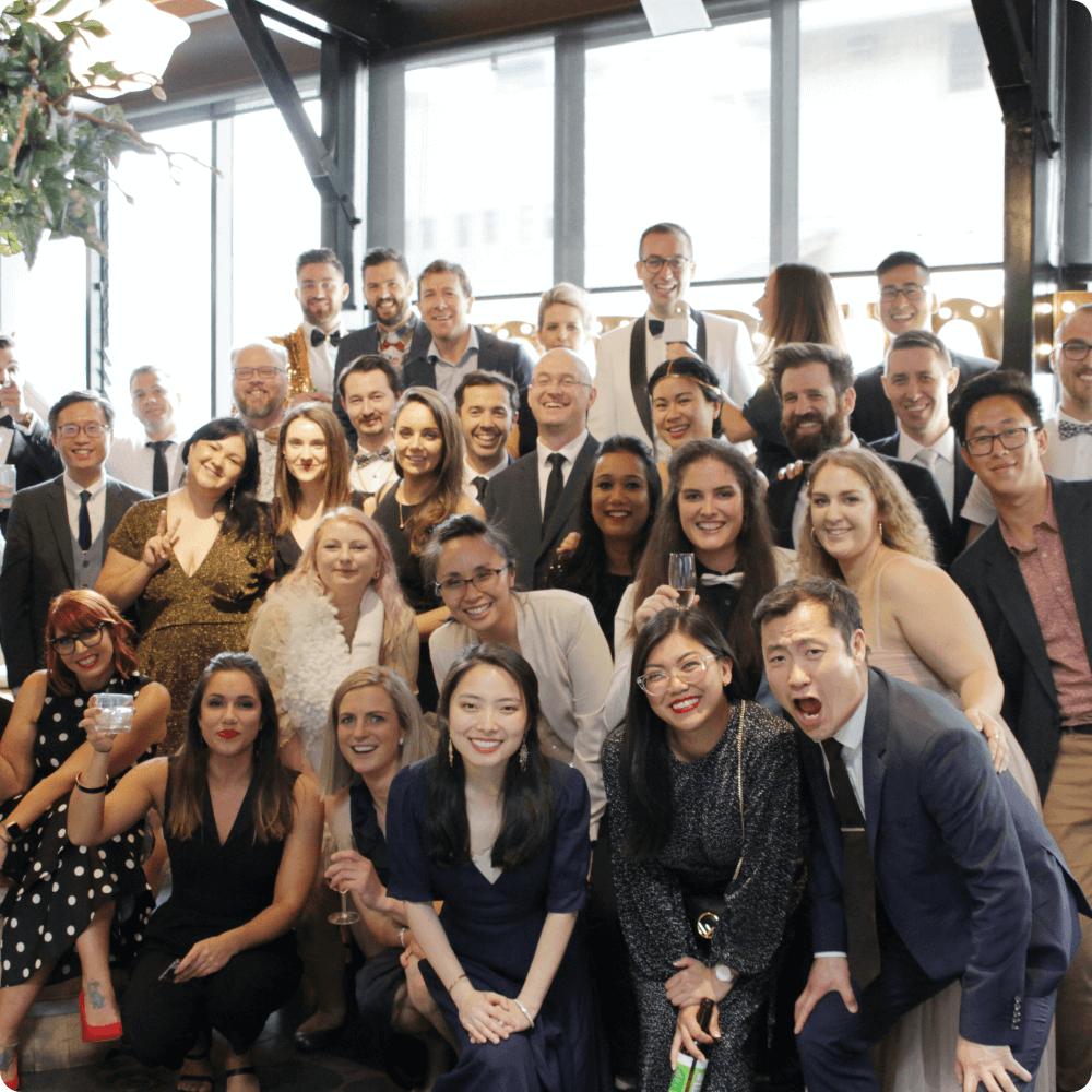 Instructure Employees in formal clothing smiling for picture