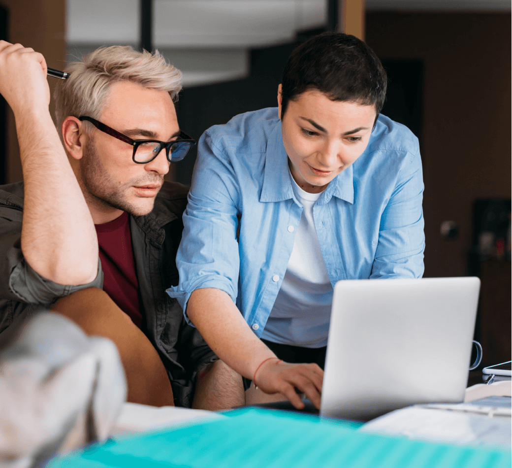 Two people looking at computer