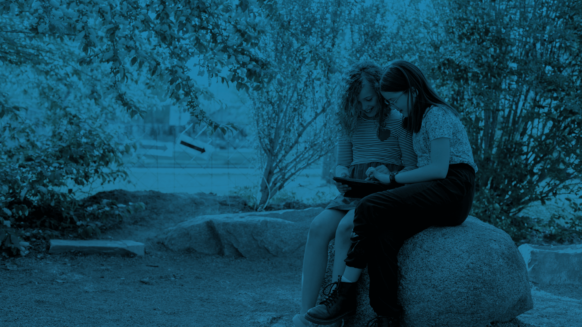 Two students using a tablet