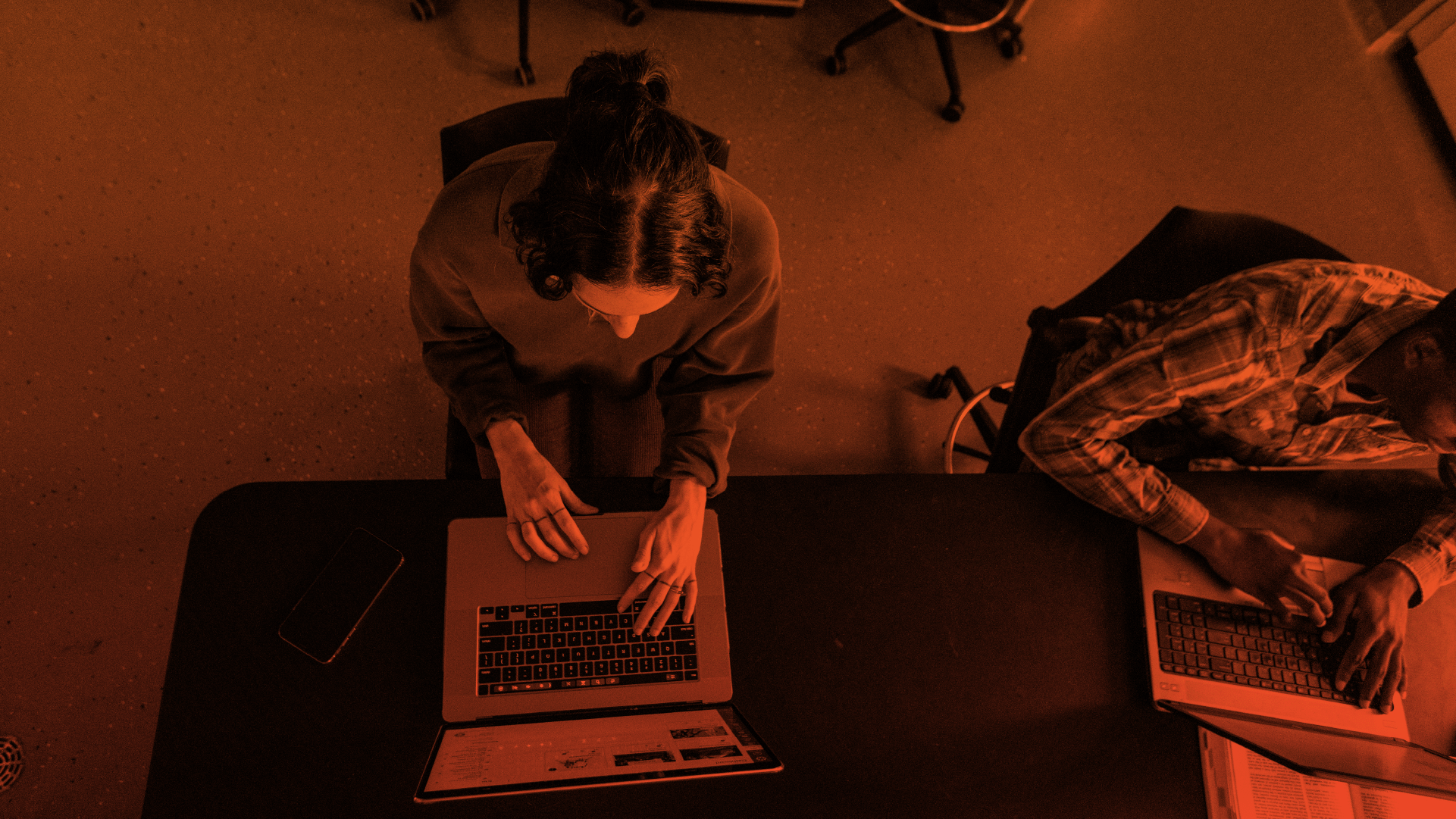 Students opening Canvas on their laptops while on class