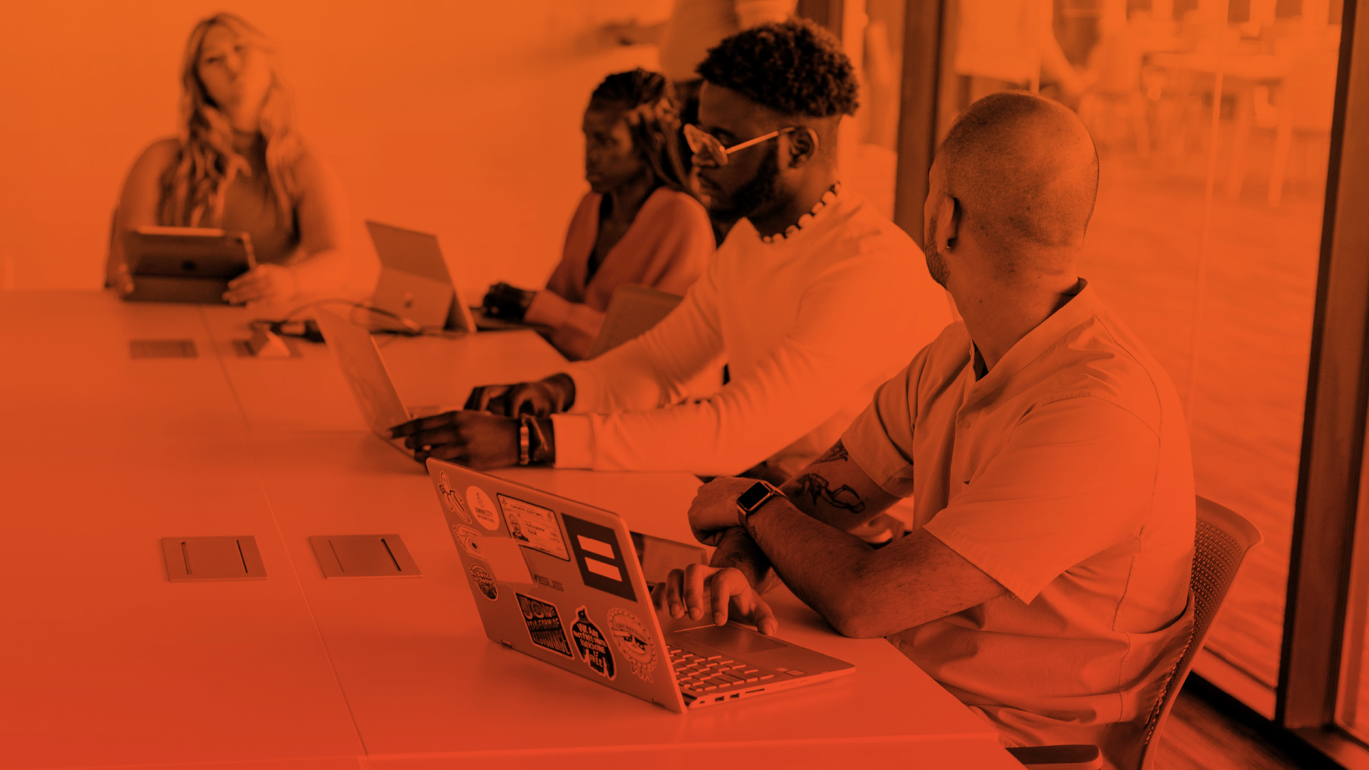 Students opening Canvas on their laptops and tablets while on class