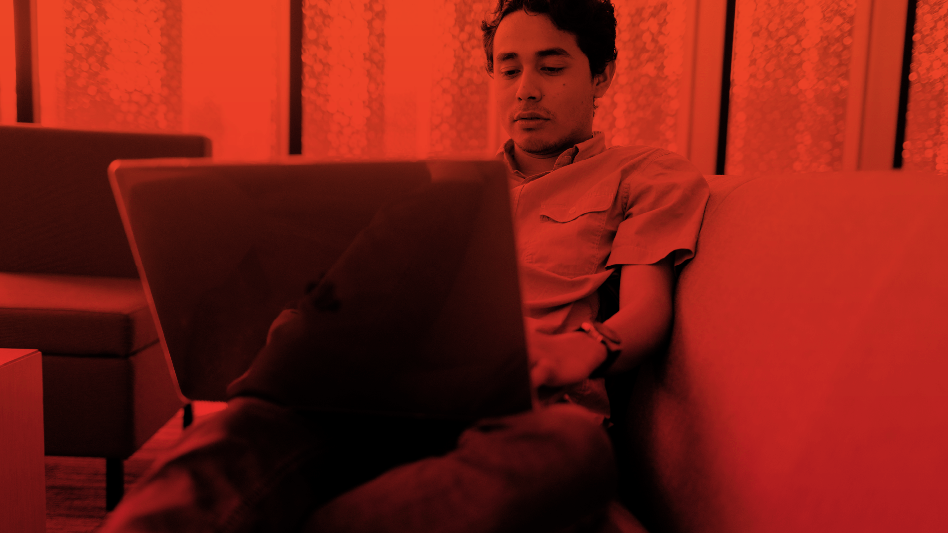 A man opening Canvas on his laptop