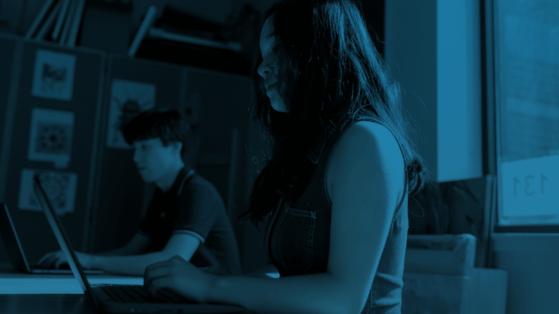 Two students using their laptops