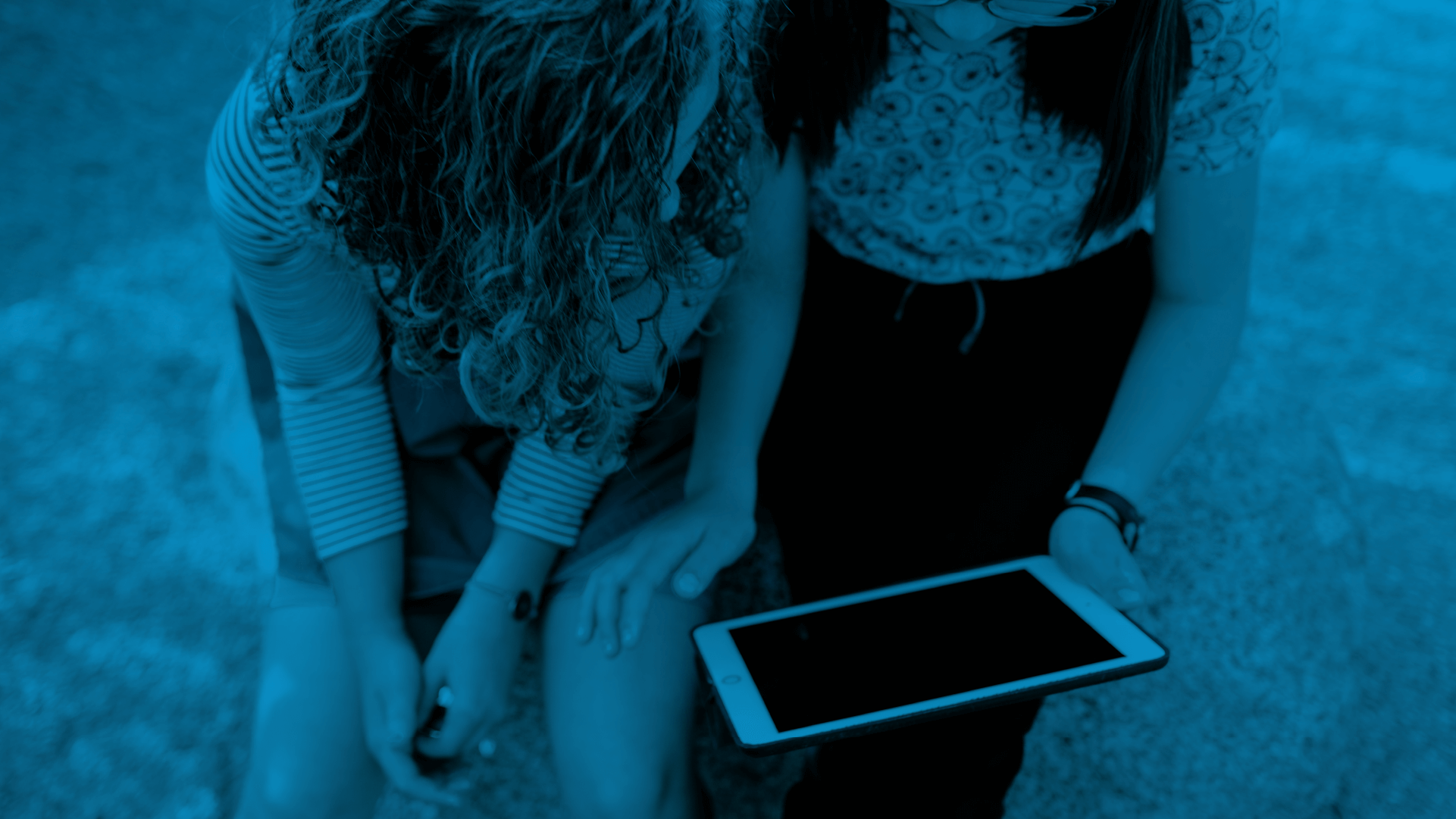 Two students using a tablet