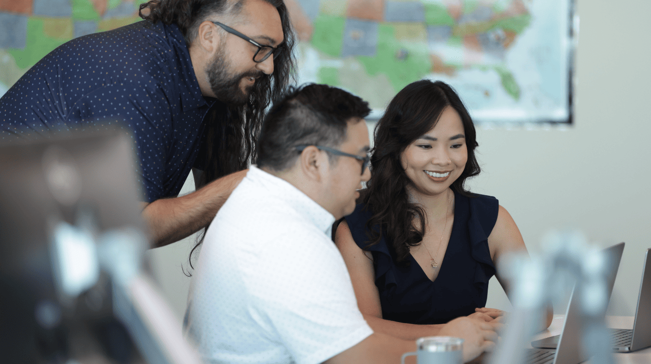 people looking at a laptop