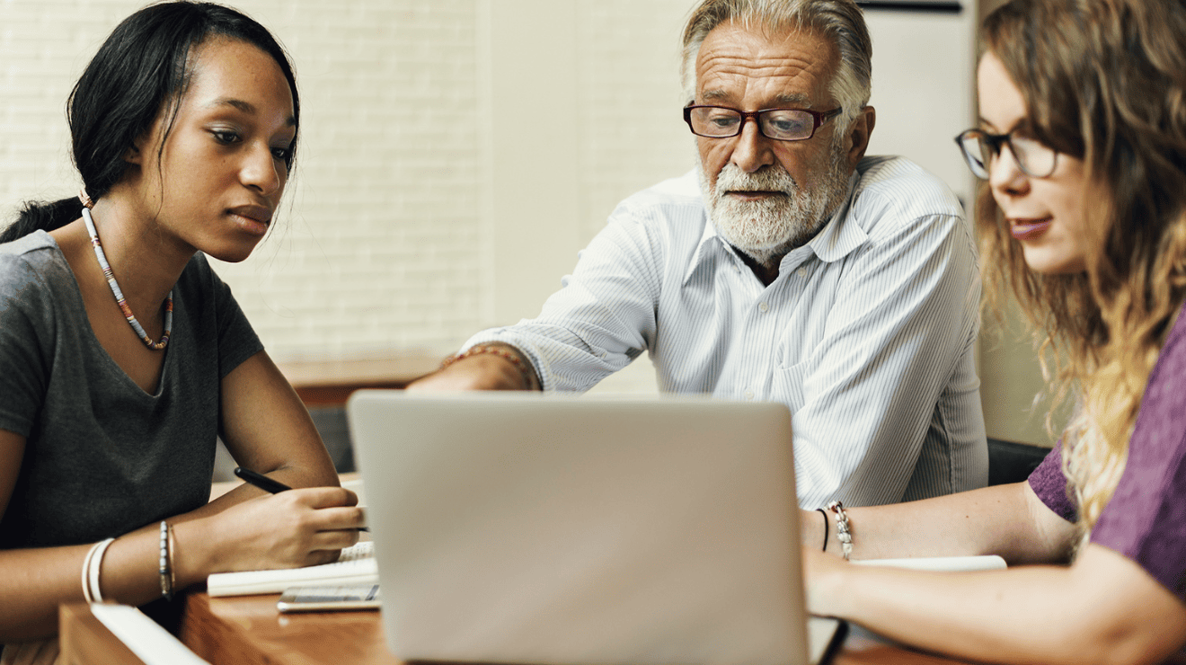 people looking at a laptop
