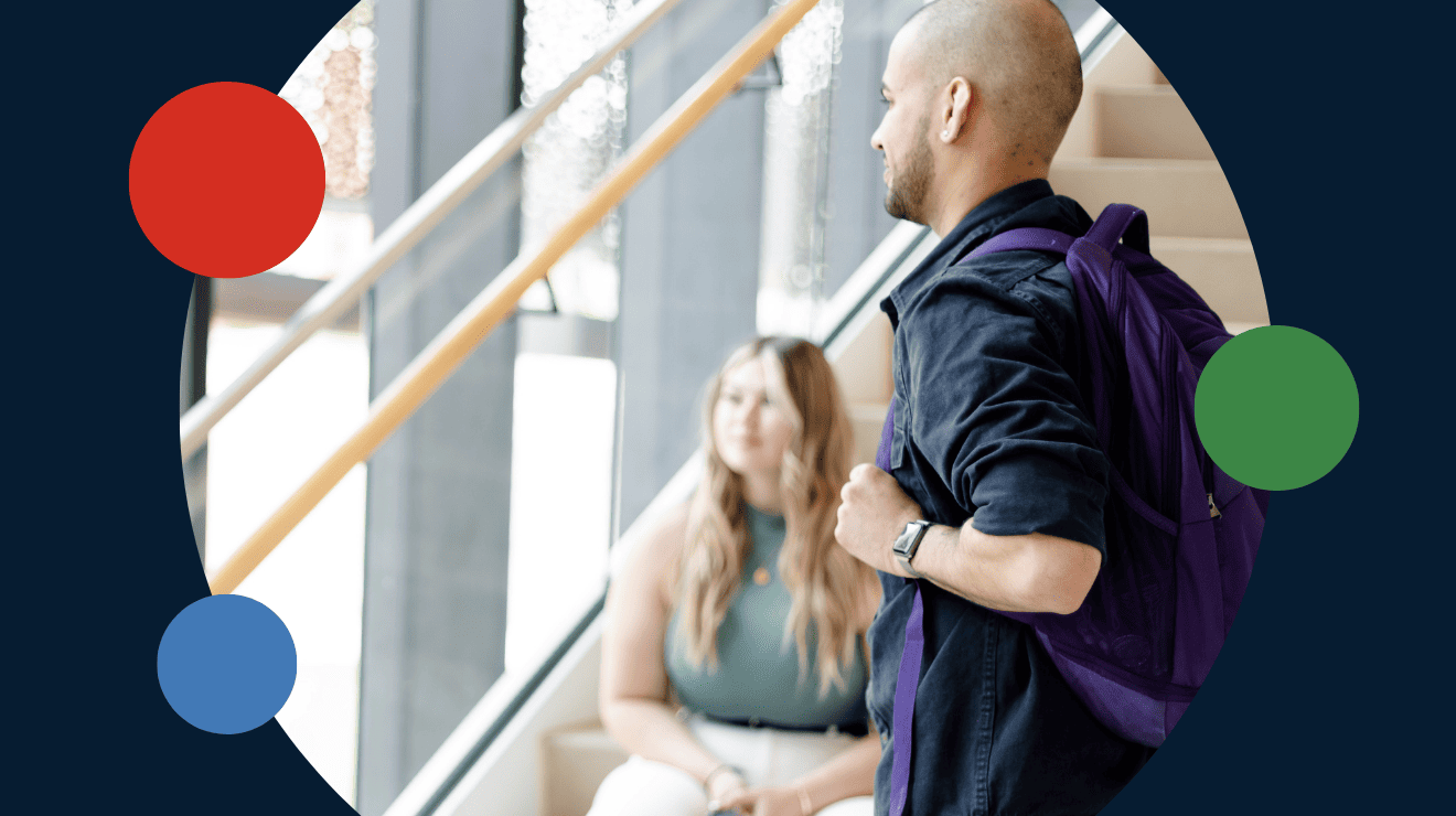 A man and woman sit on stairs, resting with a backpack beside them, enjoying a moment together outdoors.