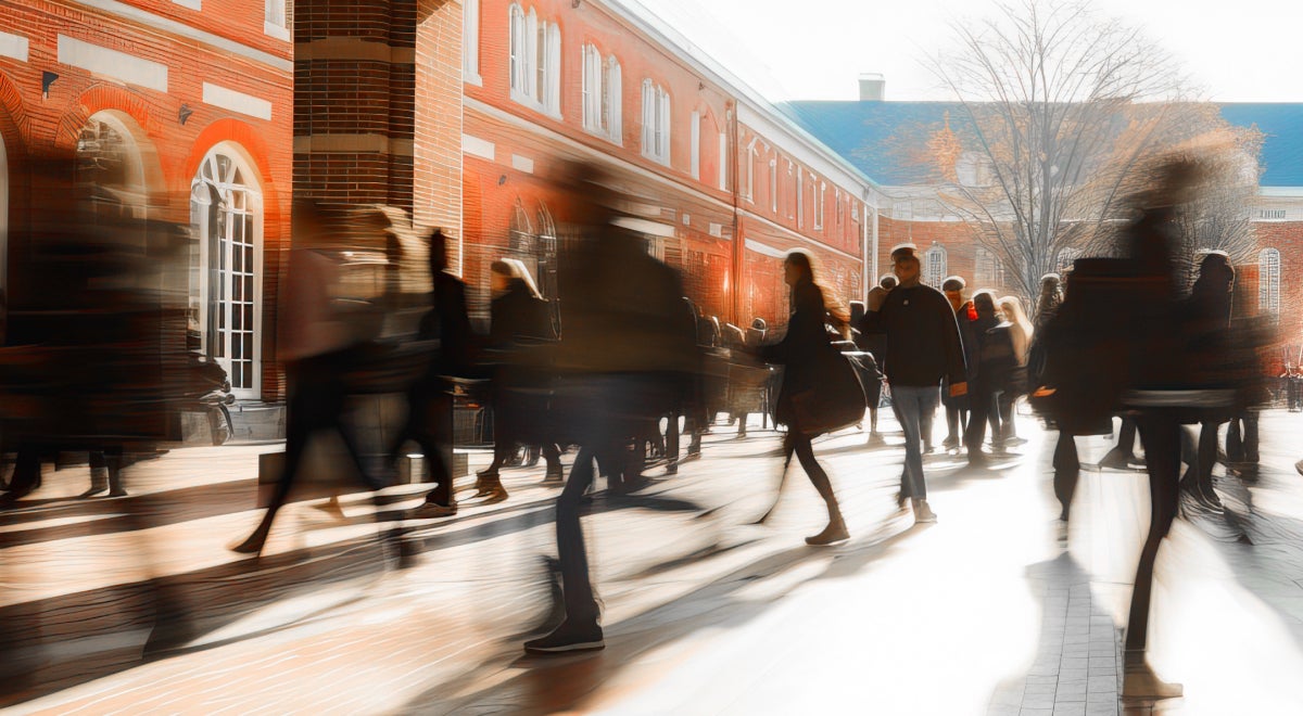 People walking in different directions with a blurred motion effect