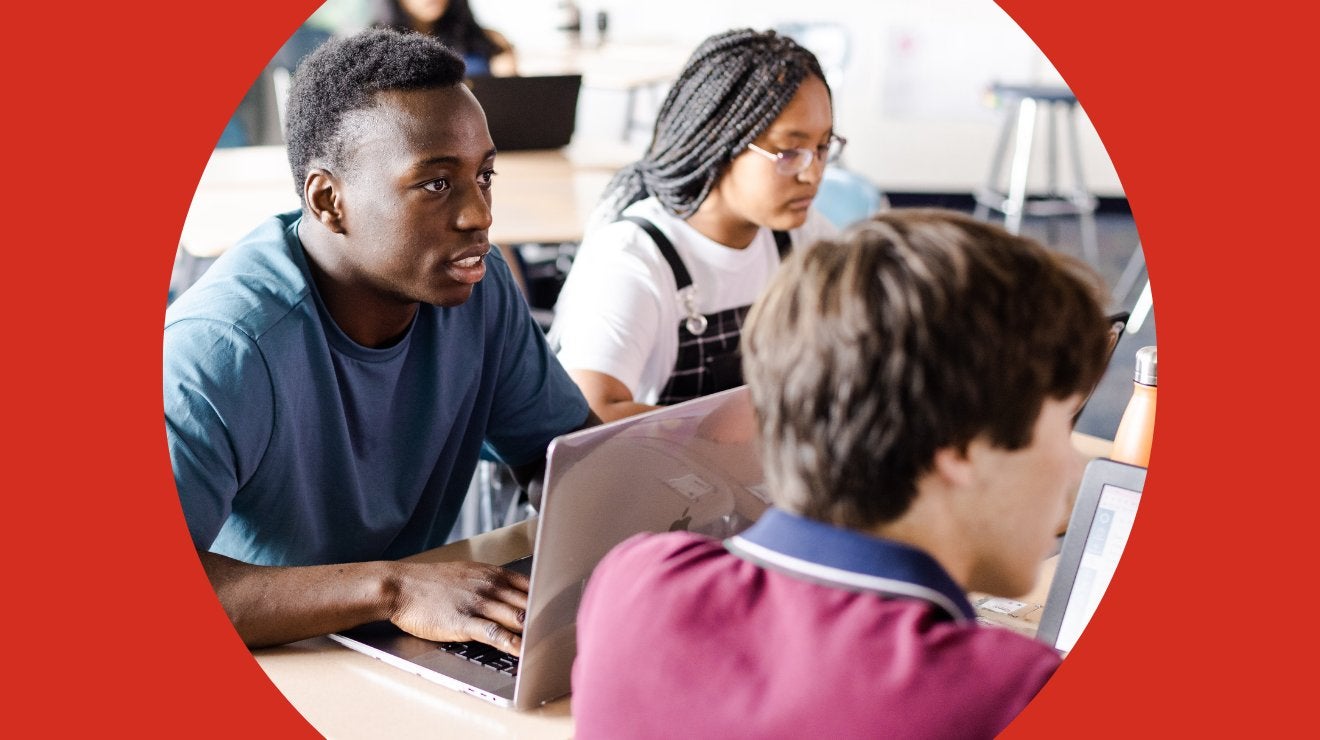 Students using laptops in a classroom