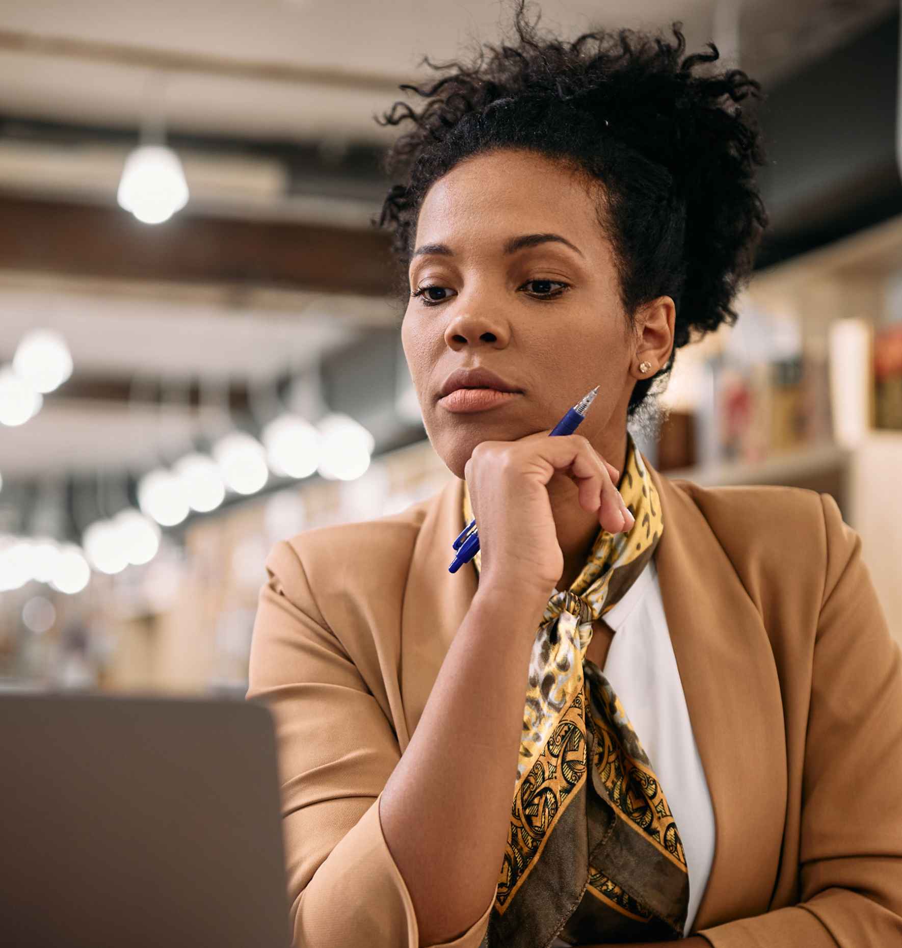 A woman looking at a laptop
