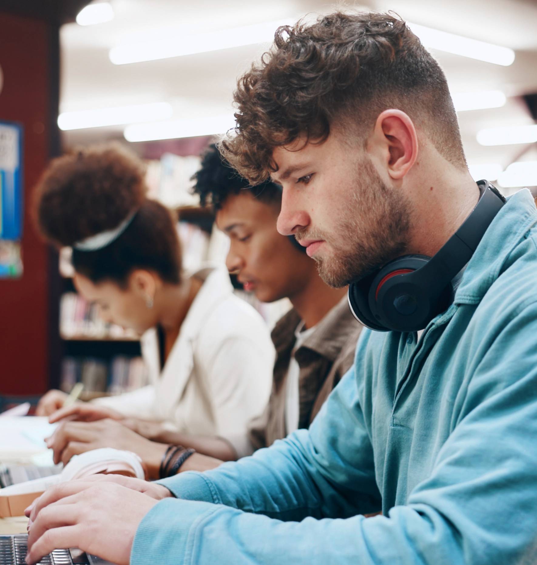 A group of students studying in a library