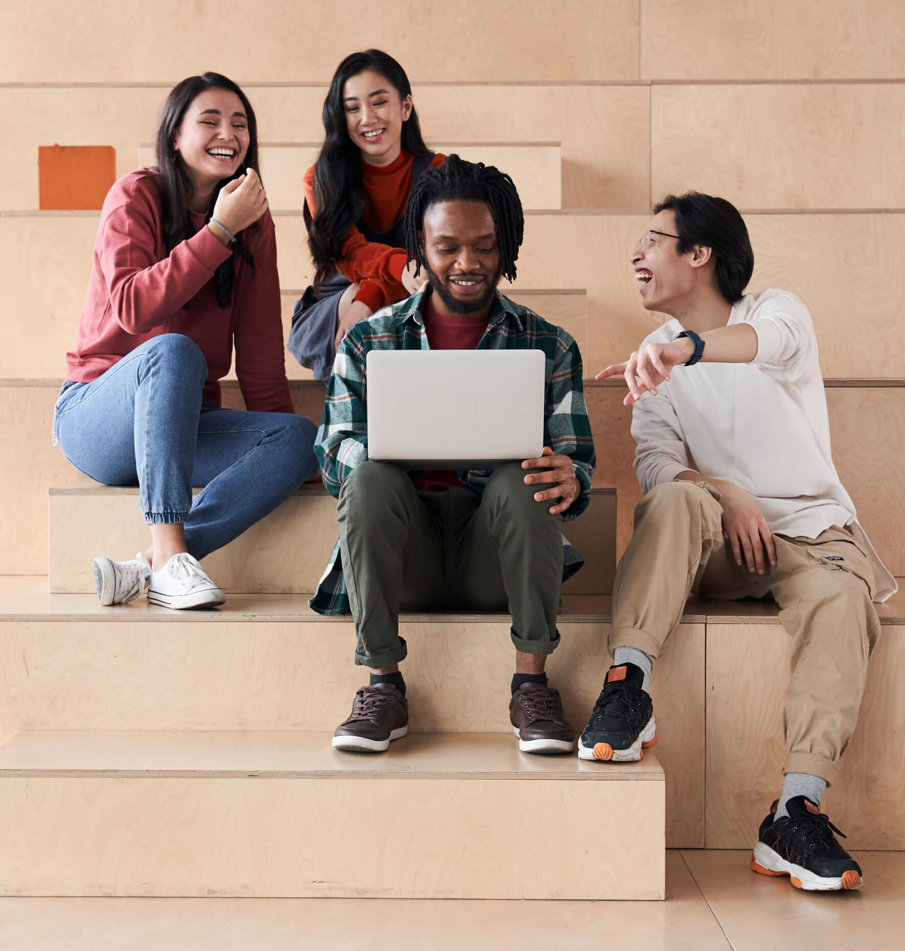 A group of college students studying on a staircase