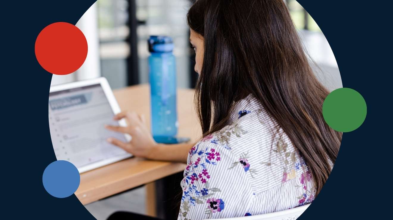 a woman plans assessments on a tablet