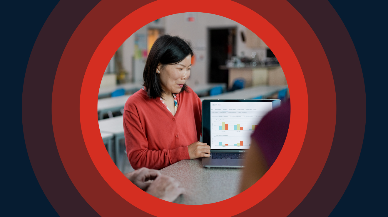 Image of a woman in a red shirt next to her laptop with Canvas displayed