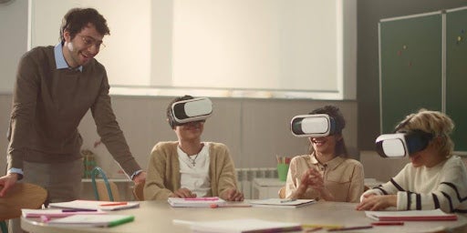 Students using a virtual lab and simulation for a lesson