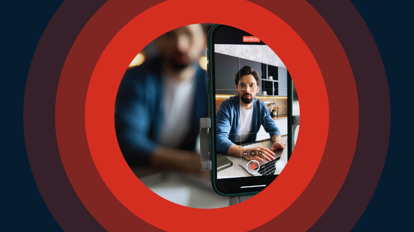 A man being filmed for an interview using a mobile phone