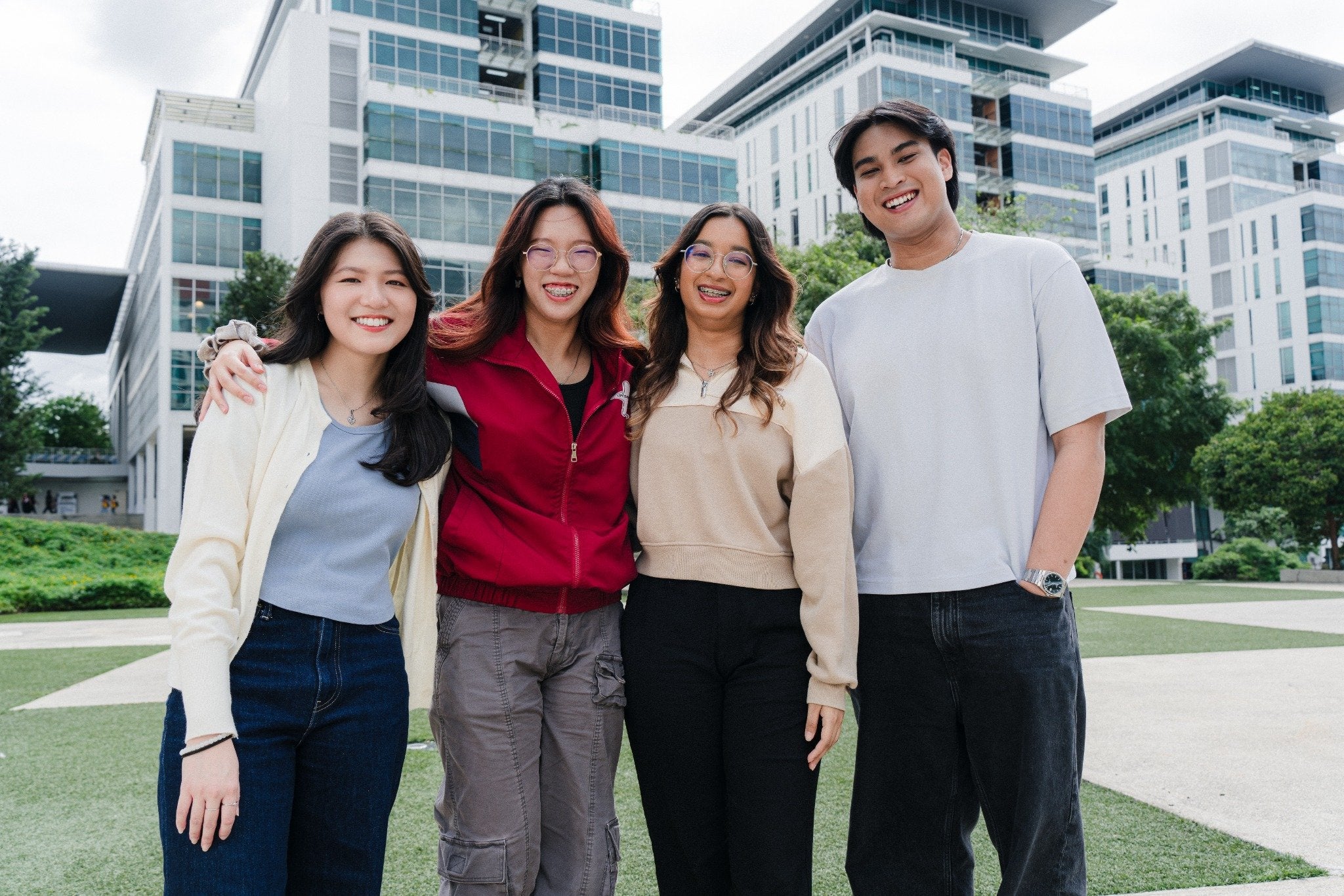 University students in front of a high rise campus