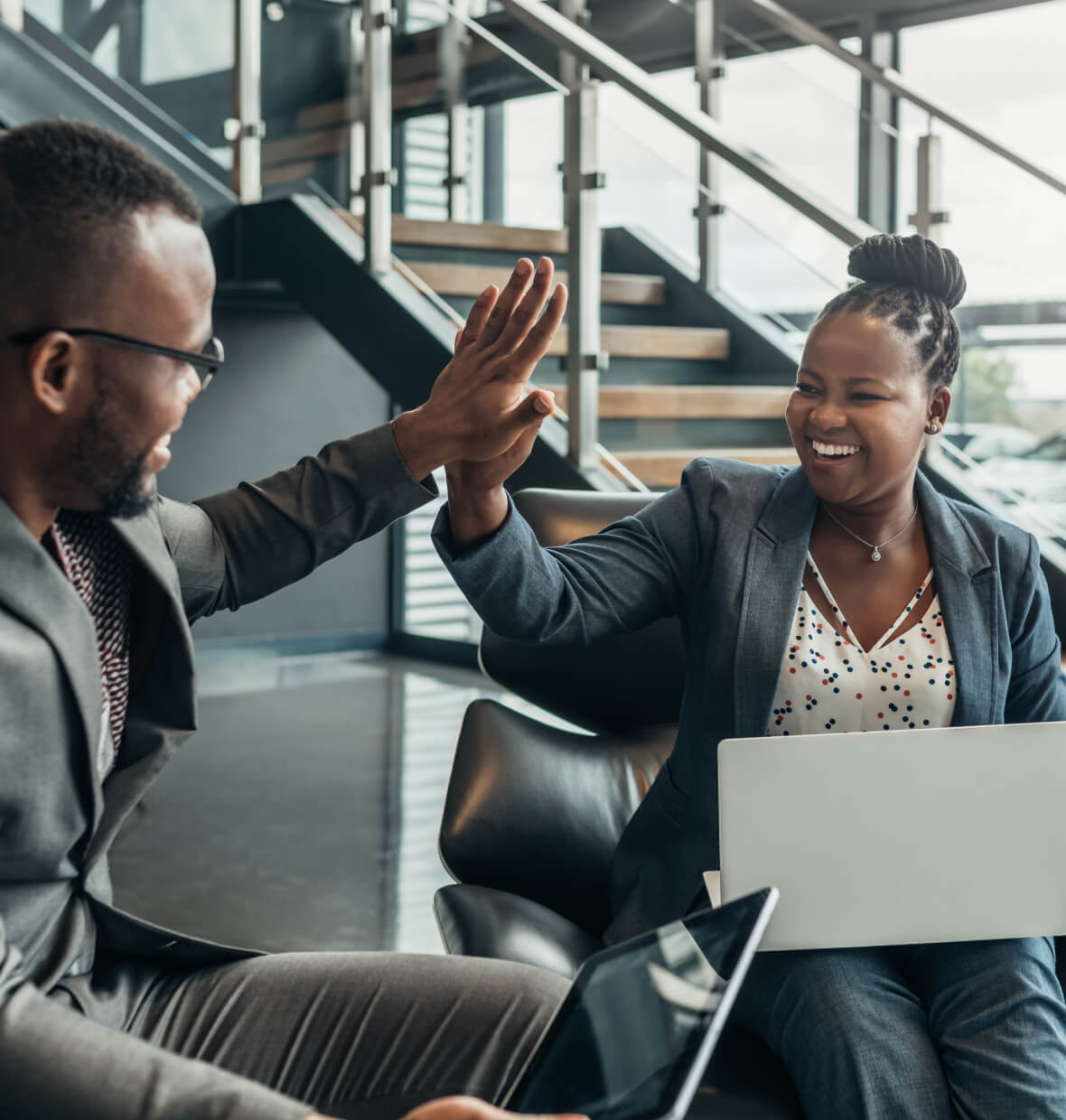 Co-workers high-fiving