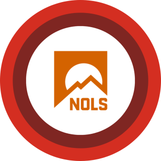 NOLS logo centered on red and maroon concentric rings.