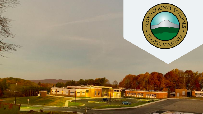Image of school building with red and green leaves on tress in the background and Floyd County School Logo in the foreground