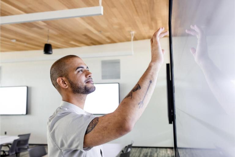 man using whiteboard