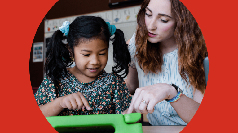 A woman assists a child as they both work on a tablet, fostering learning and interaction.