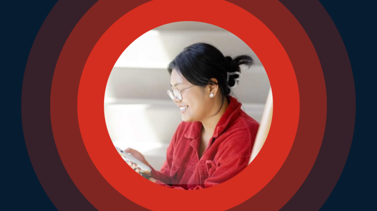 A woman in a red shirt sits on a couch, with a background of red circles.