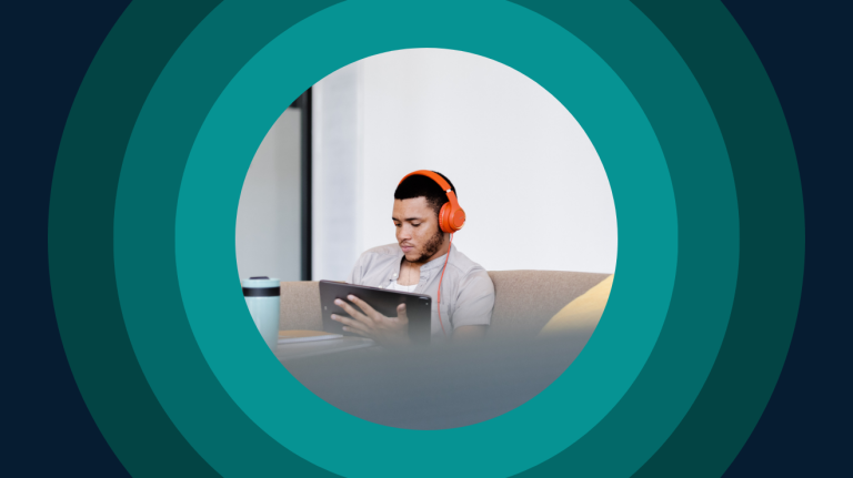 Student with headphones focused on tablet, symbolizing digital learning, remote study, and engagement in online education.