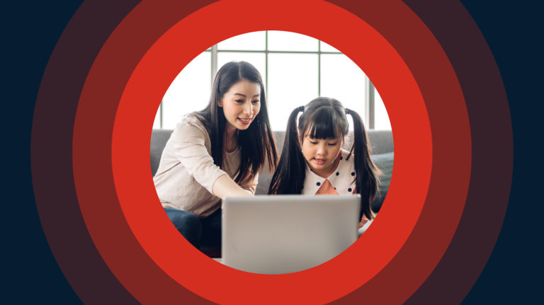 Mother and daughter using laptop