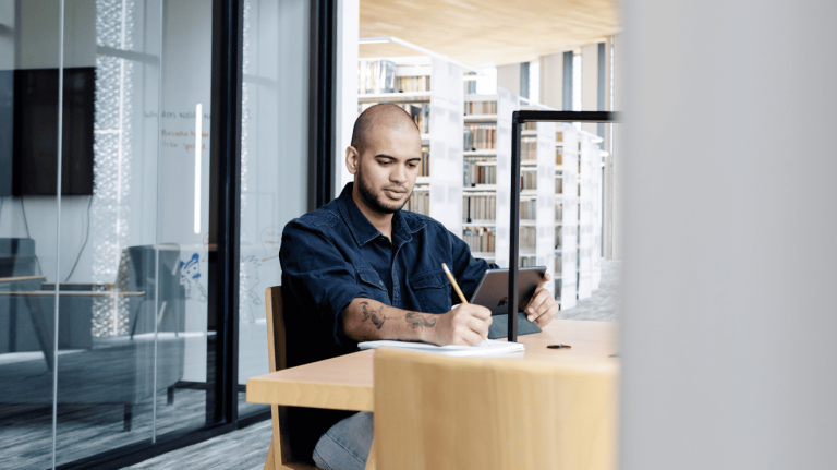 A man writing on a paper
