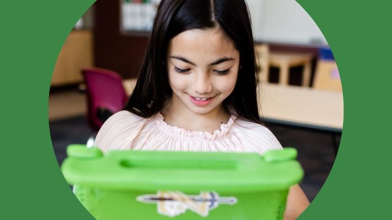 A k-12 student learning on a tablet