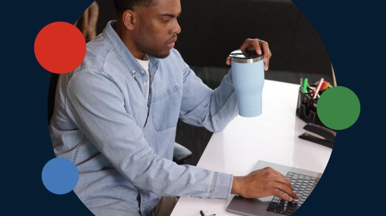 An educator working on a laptop