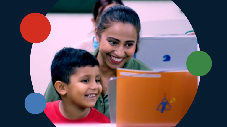 A young Yamaha Music School student and his mother sit in a music class in Malaysia