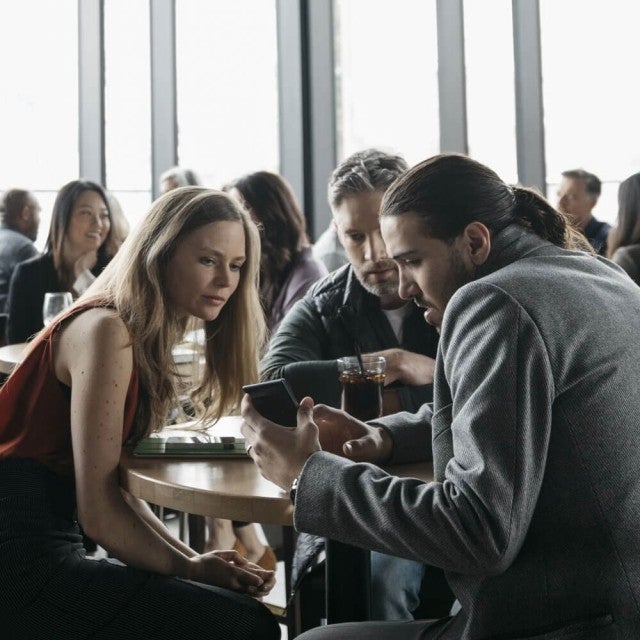 People working together at table in cafeteria