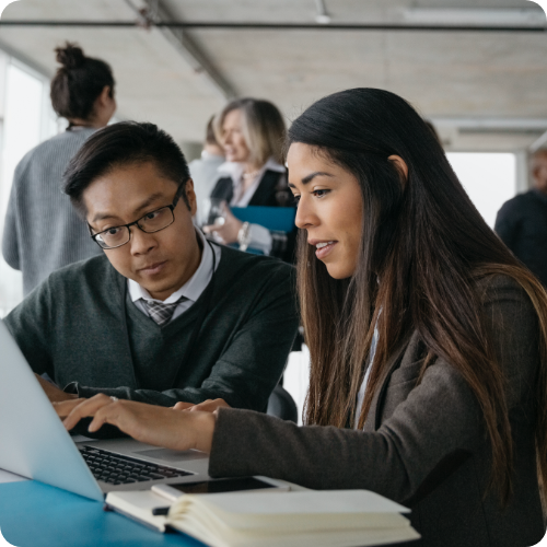 Two people working together on laptop