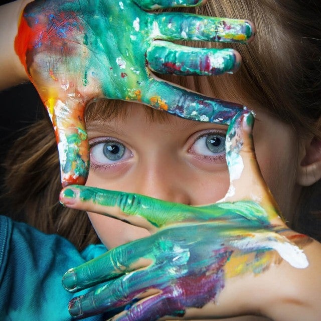 Female child with pain on their hands looking at camera