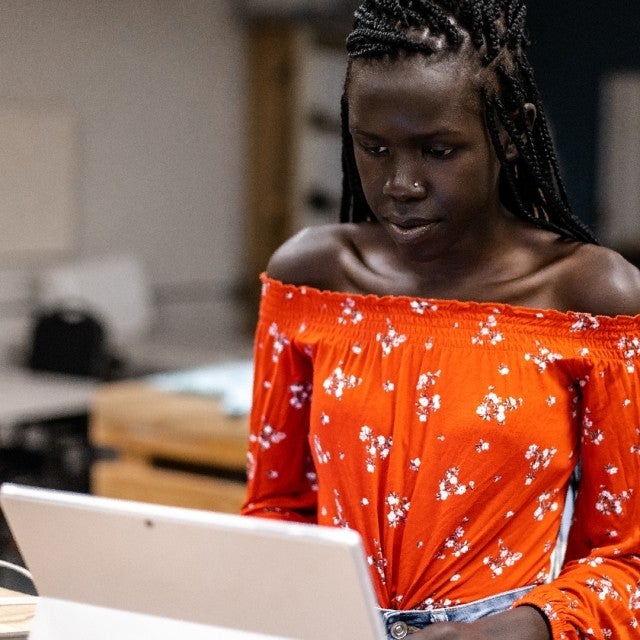 Ai Hub - girl looking at laptop