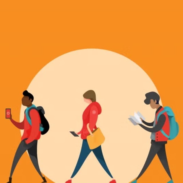 Students walking in front of a circle