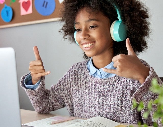 girl using Canvas Studio at home desk