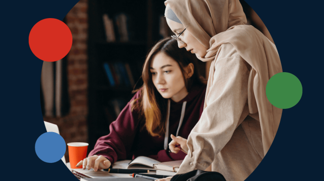 Two women collaborate on a laptop, focused on their work, with circles in the background.