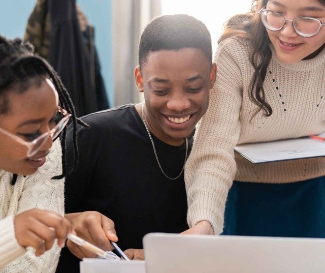 Students collaborating at a work table
