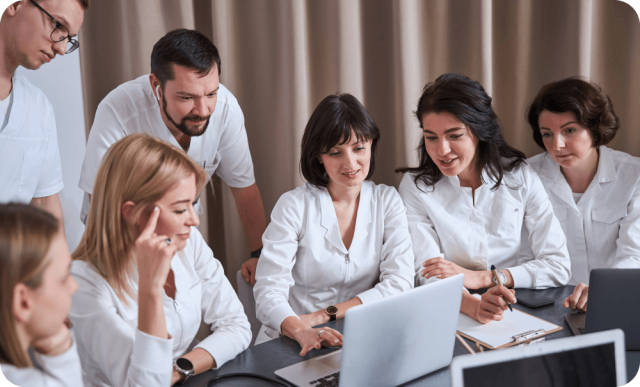 people looking at laptop