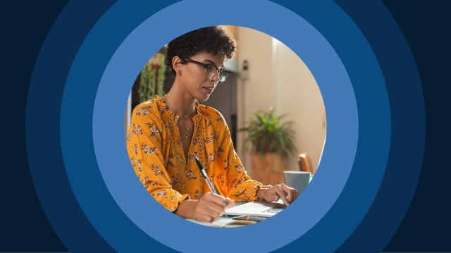 a district admin works on a computer in her office